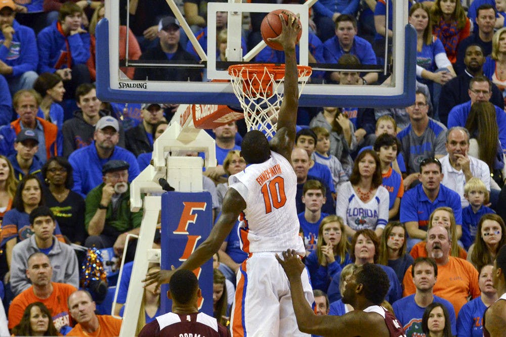<p>Dorian Finney-Smith dunks during Florida's 72-47 win against Mississippi State on Saturday in the O'Connell Center.</p>
