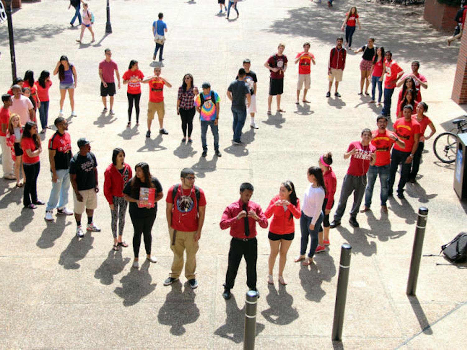 The members of fraternity Beta Chi Theta form a heart on Turlington Plaza on Tuesday afternoon. The fraternity held philanthropic events all week for the Beating Heart Disease campaign.