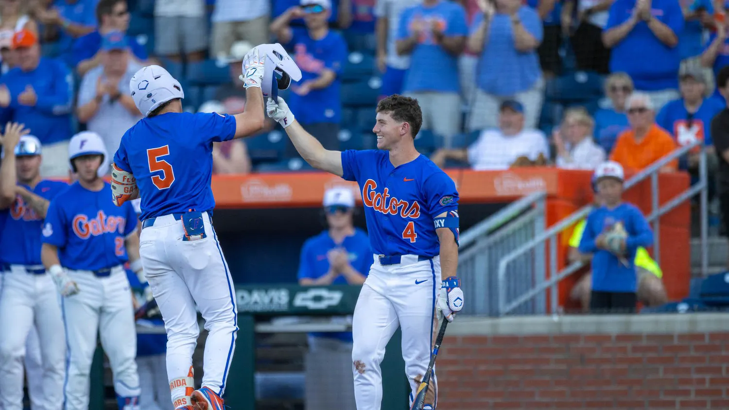 Florida infielder Cade Kurland (4) and infielder Blake Cyr (5) high-five after a home run during an NCAA college baseball game against Auburn at Condron Family Ballpark in Gainesville, Fla., Friday, April 17, 2026.