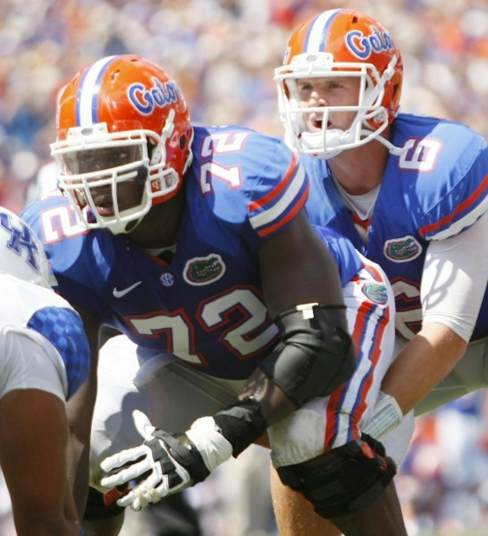 <p>Junior center Jonotthan Harrison (72) waits to snap the ball to sophomore Jeff Driskel (6) during Florida's 38-0 win against Kentucky at Ben Hill Griffin Stadium on Sept. 22.&nbsp;</p>