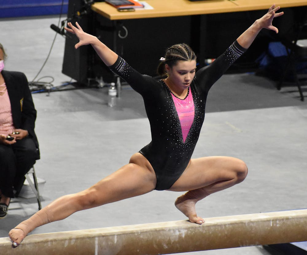 Megan Skaggs performs on the beam in a meet against Kentucky on February 19. The senior announced she would return for a fifth year via Twitter on April 23.