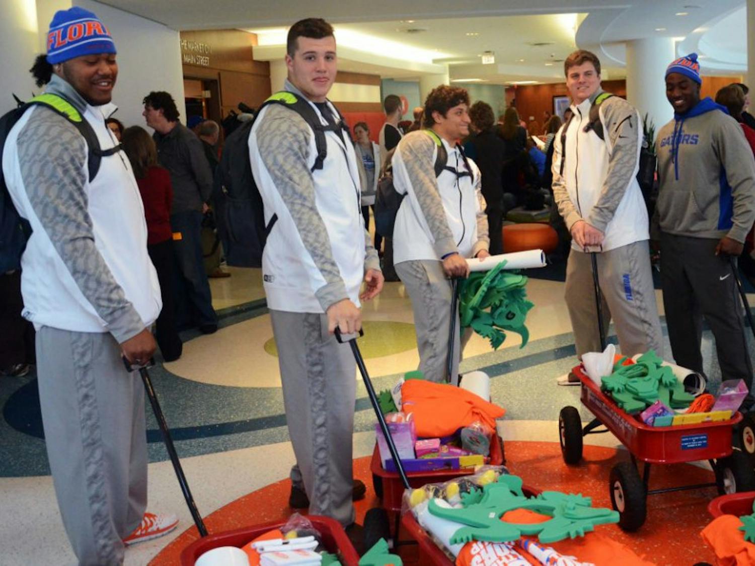 Twenty-three UF football players spent Thursday afternoon visiting patients at the Children's Hospital of Alabama at UAB in Birmingham.