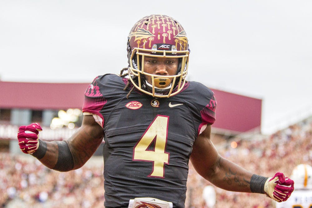 <p>FSU running back Dalvin Cook celebrates a touchdown run in the first half of Florida State's 52-13 win against Chattanooga on Nov. 21, 2015, in Tallahassee</p>