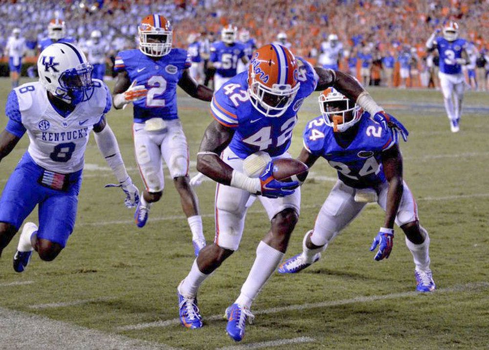 Florida safety Keanu Neal intercepts a pass during the Gators' 36-30 triple-overtime win against Kentucky on Sept. 14, 2015, at Ben Hill Griffin Stadium.