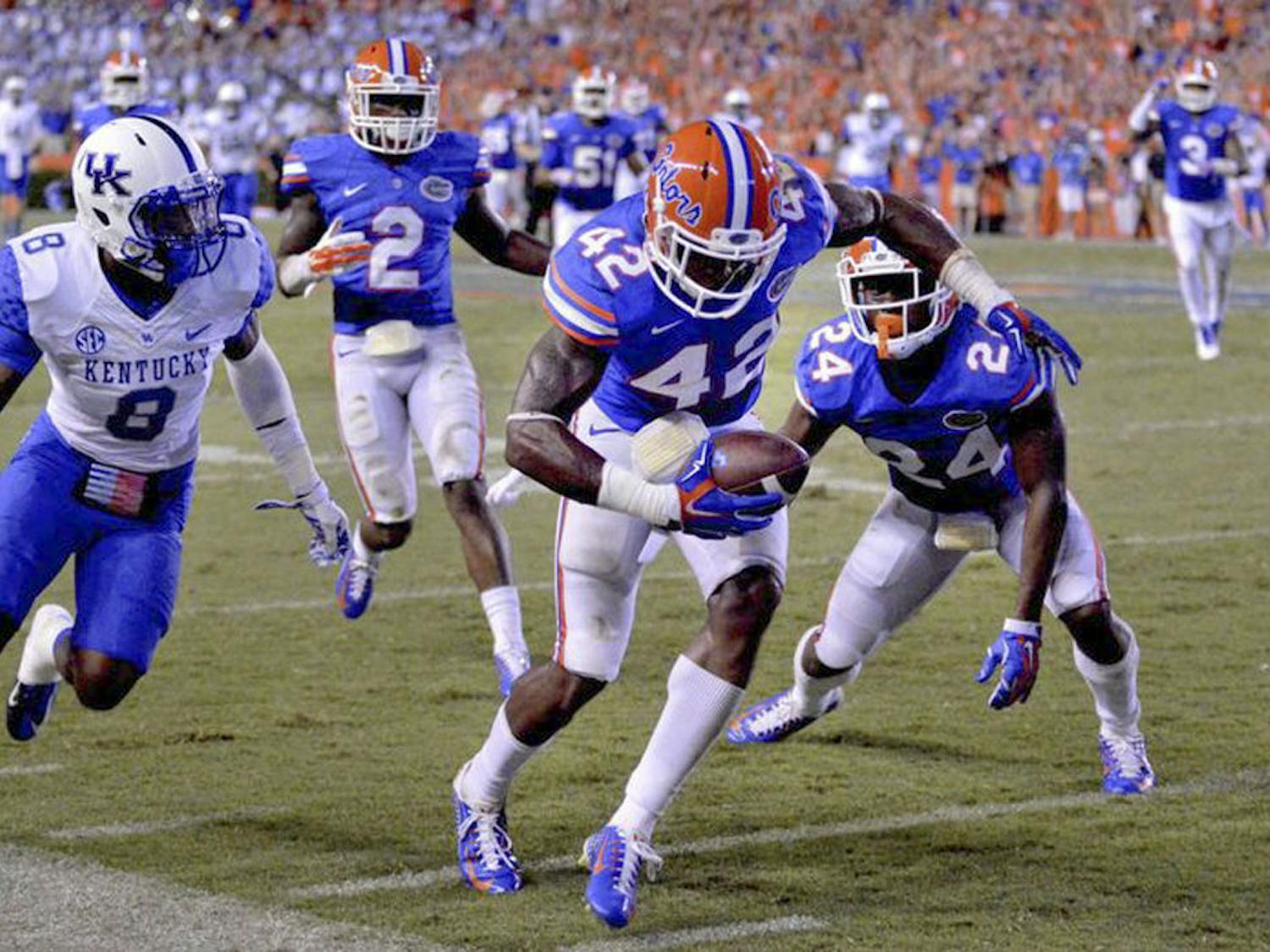 Florida safety Keanu Neal intercepts a pass during the Gators' 36-30 triple-overtime win against Kentucky on Sept. 14, 2015, at Ben Hill Griffin Stadium.