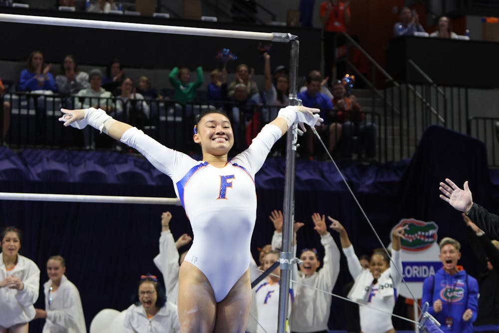 Florida sophomore Leanne Wong sticks her landing after her uneven bars routine in the Gators win against the Georgia Bulldogs Friday, Jan. 27, 2023.