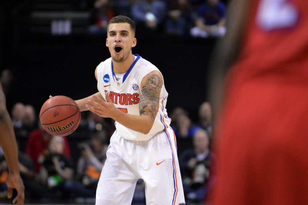 <p>Scottie Wilbekin calls out a play to his teammates during Florida’s 62-52 win against Dayton on Saturday in FedEx Forum in Memphis, Tenn. Wilbekin went undrafted along with fellow Florida teammates Patric Young, Casey Prather and Will Yeguete. Yeguete is the only one of the four Gators to have not signed with an NBA summer league team.</p>