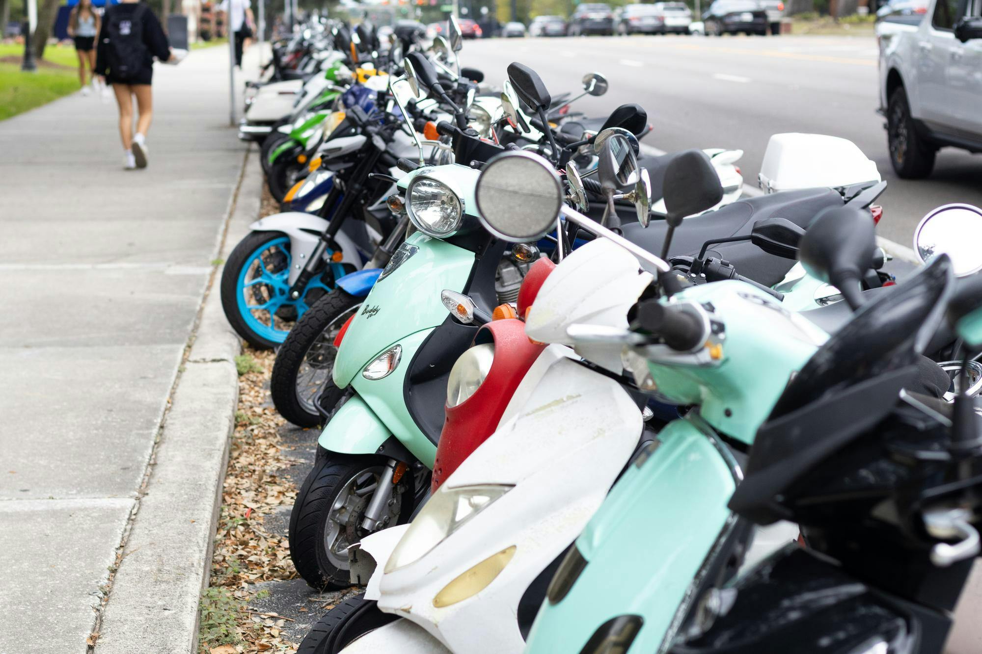 Scooters are parked in rows in front of campus, Tuesday, Sept. 29, 2026, in Gainesville, Fla.