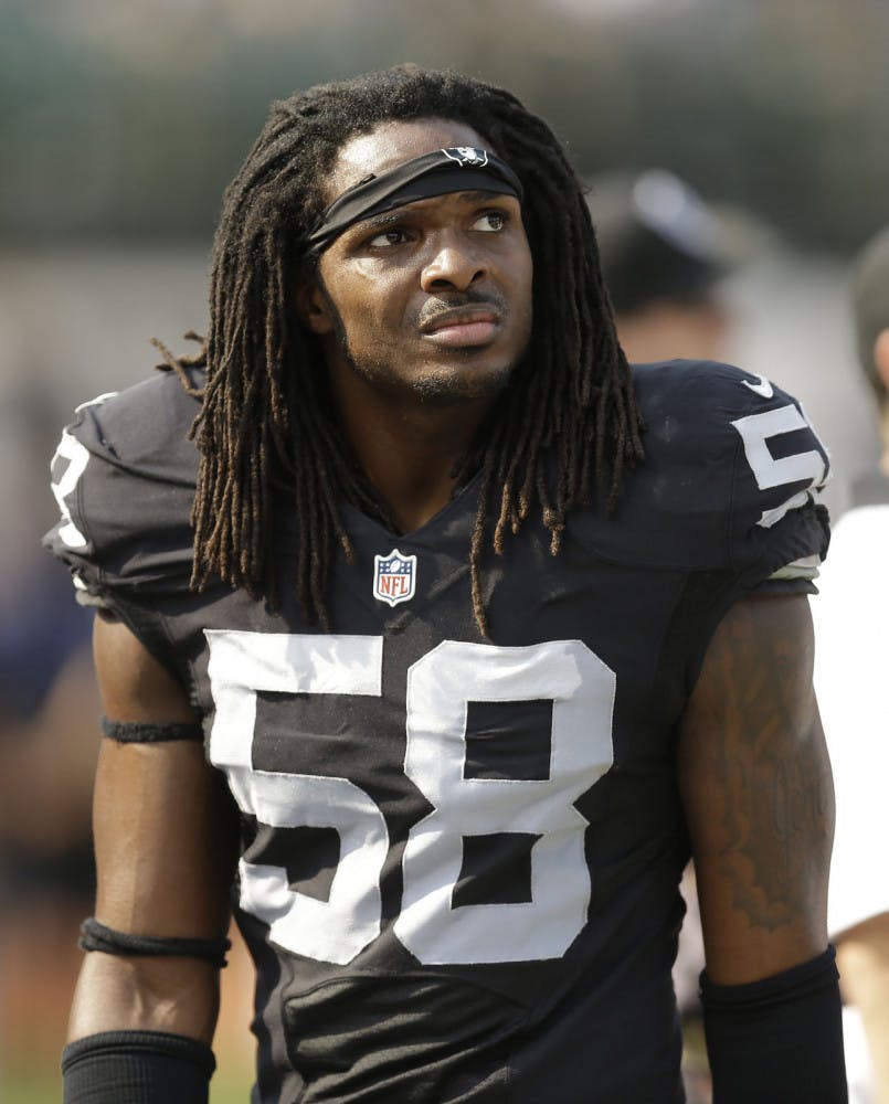 In this Sunday, Sept. 13, 2015 photo, Oakland Raiders outside linebacker Neiron Ball (58) stands on the sideline during the second half of an NFL football game against the Cincinnati Bengals in Oakland, Calif. Former Oakland Raiders linebacker Neiron Ball, who played college football at Florida after recovering from brain surgery, has died. He was 27.(AP Photo/Ben Margot)