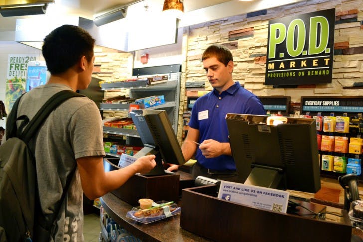 Danny Nguyen, a 19-year-old biology sophomore, bought a rainbow roll from Jason Reddy, a 22-year-old family, youth and community sciences UF alumnus. The P.O.D. Market opened Monday in the Hub.