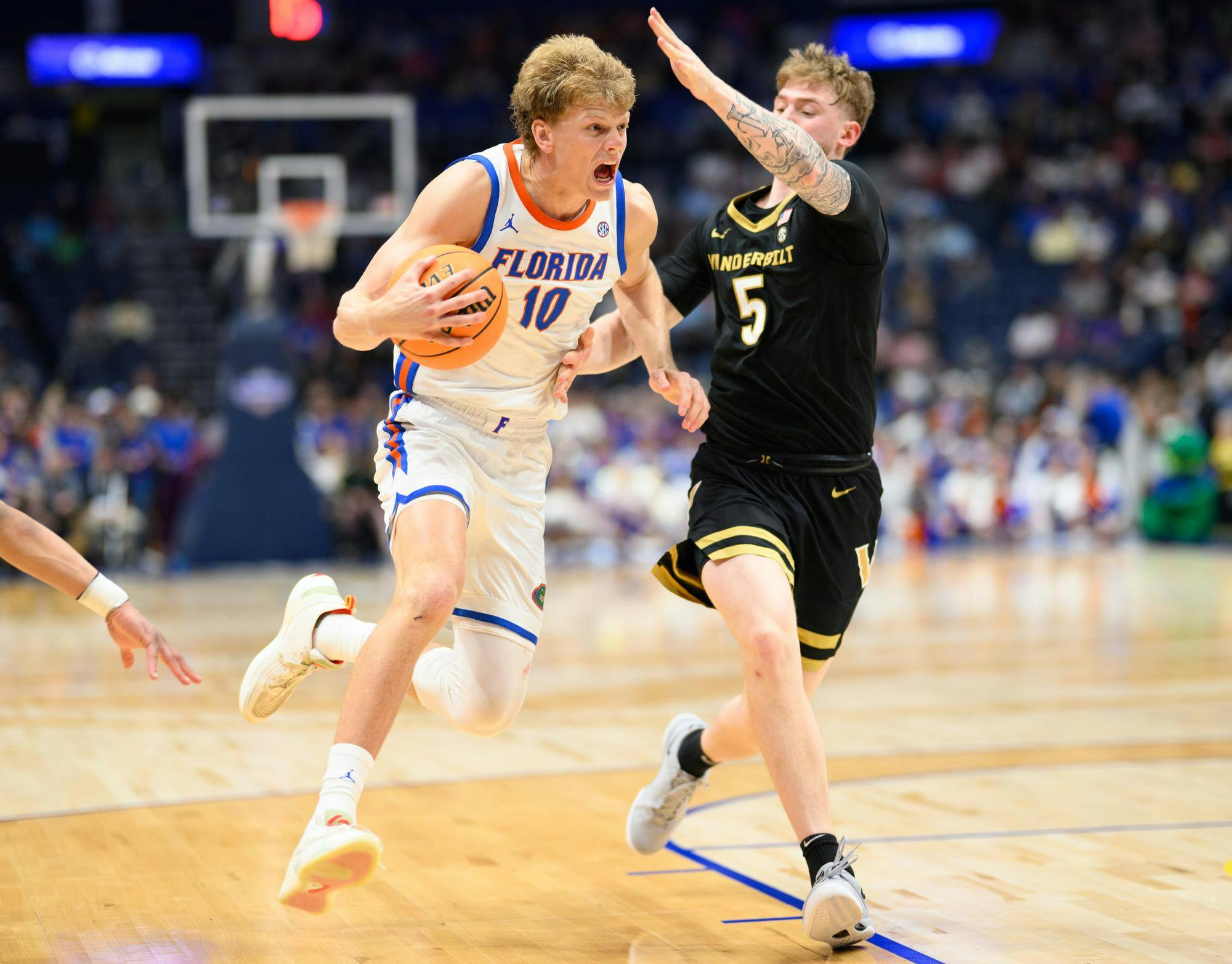 Florida forward Thomas Haugh (10) drives during the first half of an SEC Men's Basketball Tournament semifinal game against Vanderbilt, Saturday, March 14, 2026, in Nashville, Tenn.