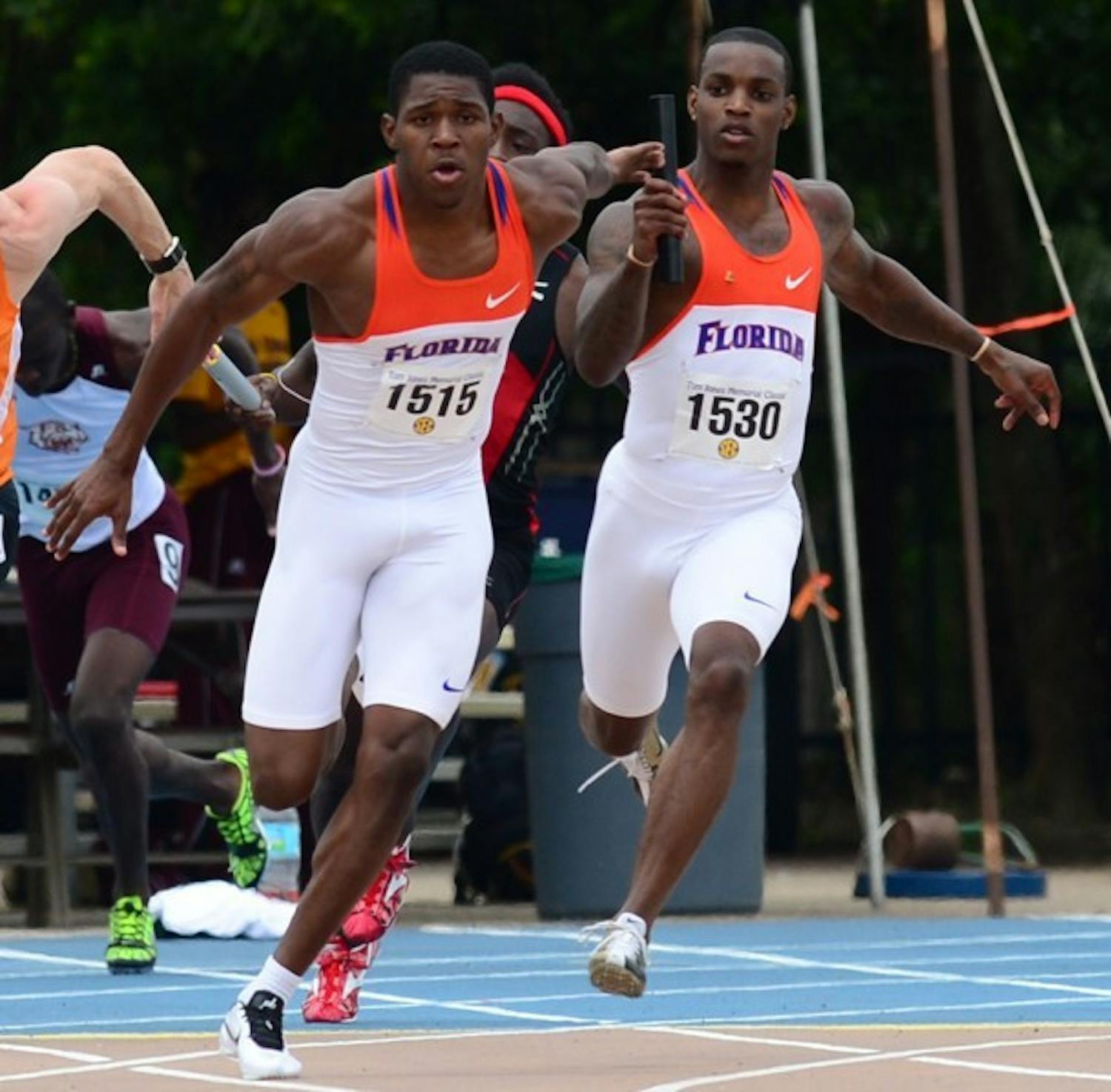 Leonardo Seymore hands the baton to Dedric Dukes in&nbsp; the 4x400 relay at the Tom Jones Classic on April 21, 2012. Dukes won the men's 200m at the Florida Relays on Friday.