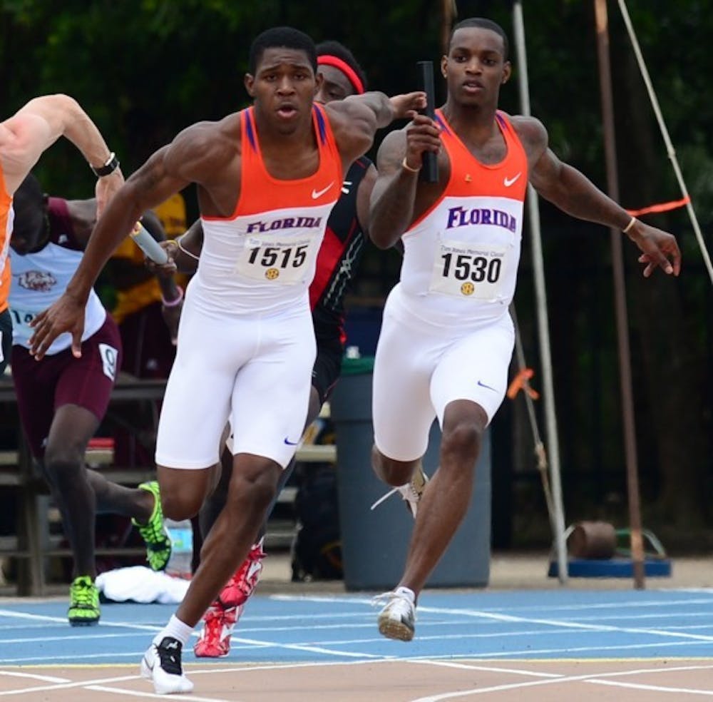 <p>Leonardo Seymore hands the baton to Dedric Dukes in&nbsp; the 4x400 relay at the Tom Jones Classic on April 21, 2012. Dukes won the men's 200m at the Florida Relays on Friday.</p>