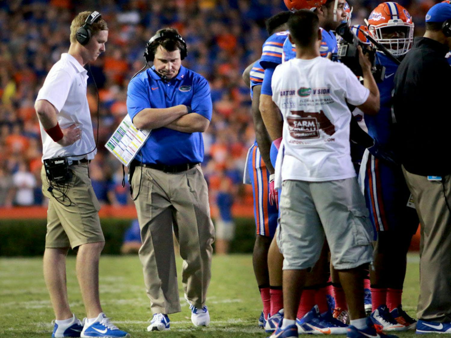 Florida head coach Will Muschamp paces on the field during Florida's 30-27 loss to LSU on Saturday at Ben Hill Griffin Stadium.