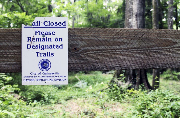 A sign at Loblolly Woods Nature Park in Gainesville warns of closures to the boardwalk Monday afternoon.&nbsp;
&nbsp;