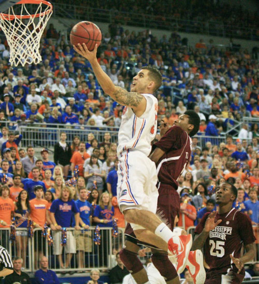 <p align="justify">Junior Scottie Wilbekin (5) attempts a layup during UF’s 83-58 victory against Mississippi State on Saturday in the O’Connell Center. Freshman Michael Frazier II replaced Wilbekin in the starting lineup because coach Billy Donovan said Wilbekin lacked energy in practice.</p>