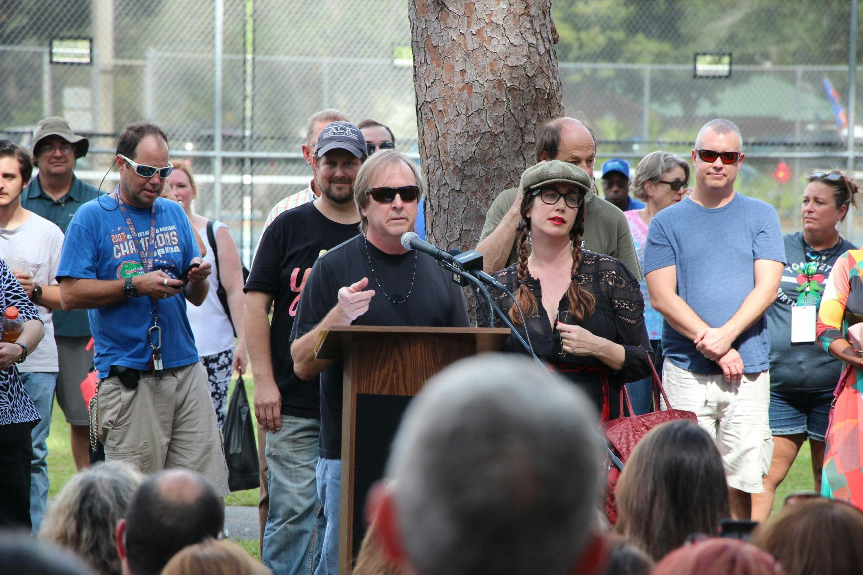 Tom Petty's brother and daughter, Bruce and Adria Petty stand behind the podium at the dedication of Tom Petty Park on Oct. 20, 2018. Both gave made statements and thanked the community before the unveiling of the new sign.