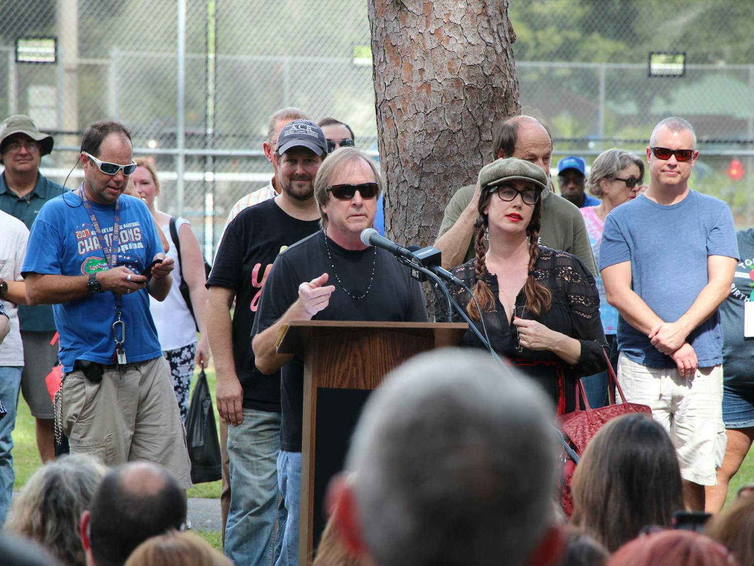 Tom Petty's brother and daughter, Bruce and Adria Petty stand behind the podium at the dedication of Tom Petty Park on Oct. 20, 2018. Both gave made statements and thanked the community before the unveiling of the new sign.