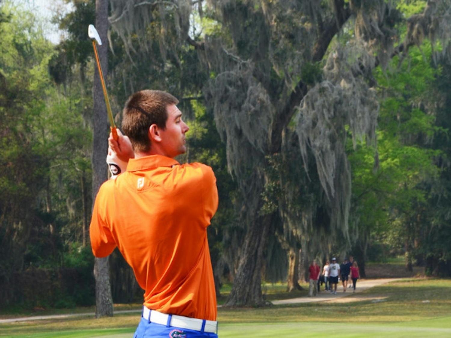Senior T.J. Vogel eyes his shot during the SunTrust Gator Invitational at Mark Bostick Golf Course on Sunday. Vogel is back with the Gators after competing in The Masters.