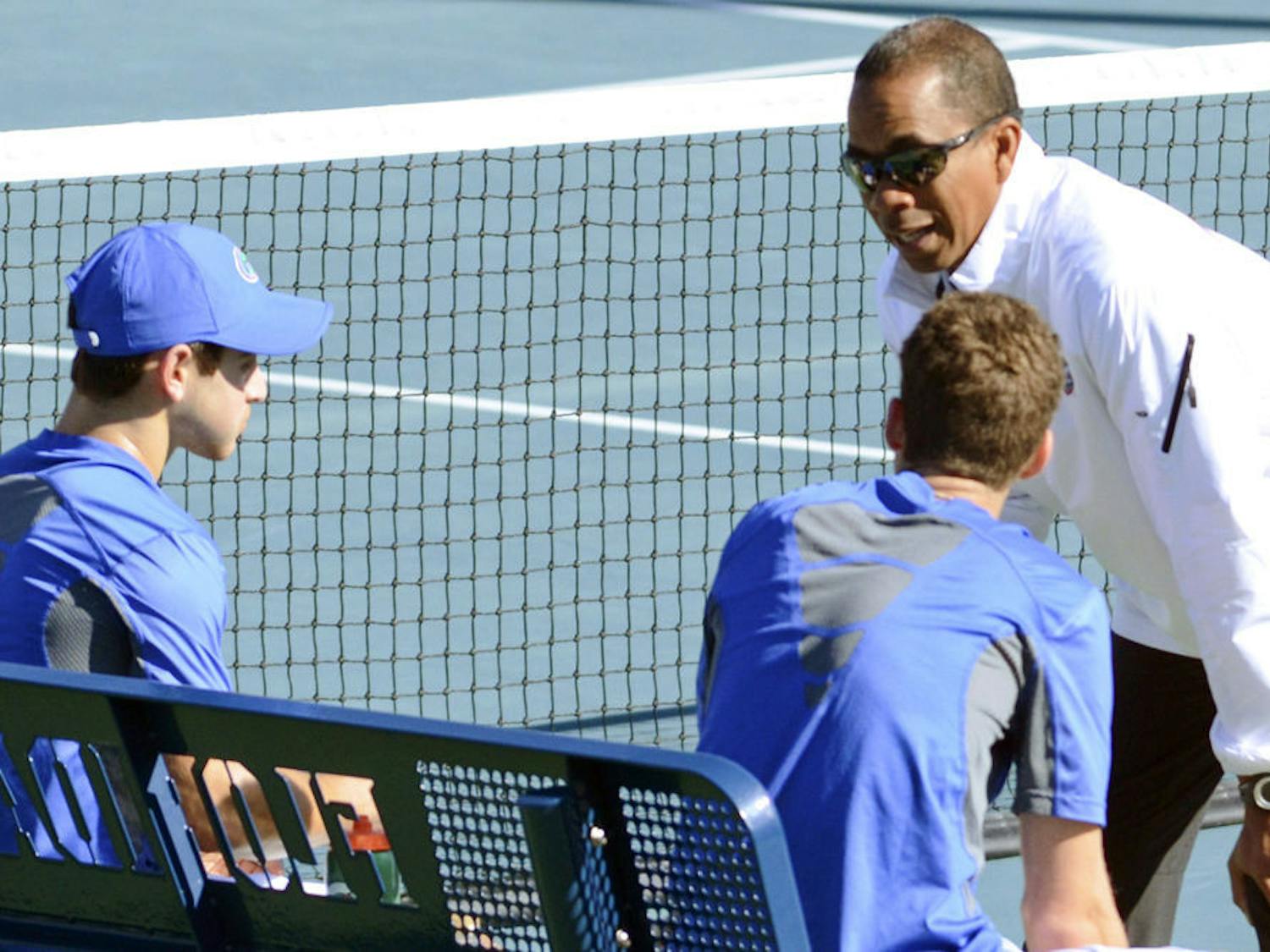 Coach Bryan Shelton talks with sophomores Elliott Orkin and Maxx Lipman during Florida's 9-3 win against William &amp; Mary on Jan. 10 at the Ring Tennis Complex.
