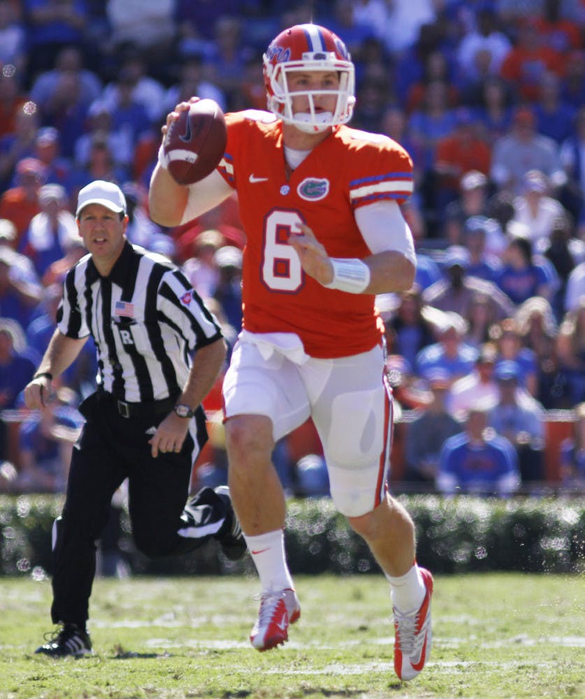 Quarterback Jeff Driskel escapes the pass rush on Saturday at Ben Hill Griffin Stadium. Florida beat Louisiana 27-20.
 