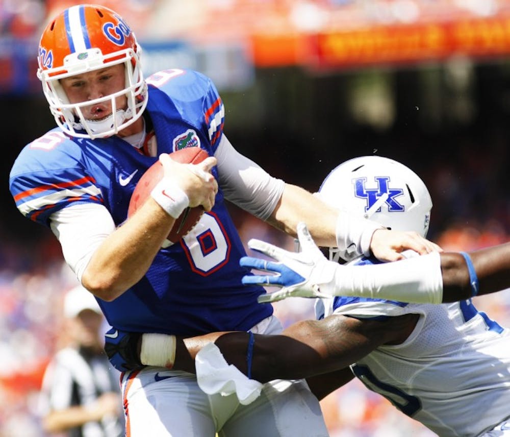 <p>Sophomore quarterback back Jeff Driskel escapes the pass rush during Florida's 38-0 win against Kentucky on Saturday at Ben Hill Griffin Stadium.</p>