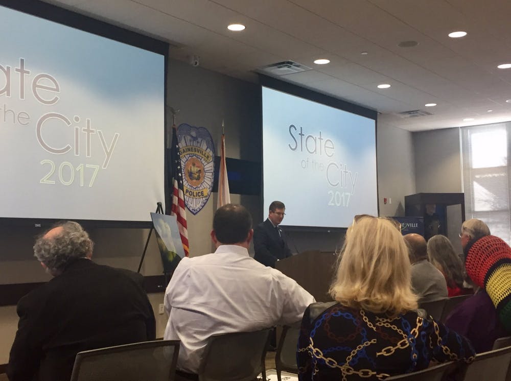 UF President Kent Fuchs spoke before city officials, UF administrators and Gainesville community members at the 2017 State of the City Address at Gainesville Police’s Hall of Heroes on Tuesday. Afterward, Fuchs and Mayor Lauren Poe signed a memorandum of understanding between the university and the city.