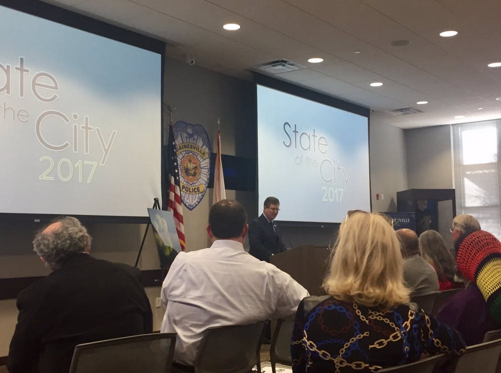 <p><span id="docs-internal-guid-b5f4bbea-3ff0-3b18-ba0c-4e08c27d6780"><span>UF President Kent Fuchs spoke before city officials, UF administrators and Gainesville community members at the 2017 State of the City Address at Gainesville Police’s Hall of Heroes on Tuesday. Afterward, Fuchs and Mayor Lauren Poe signed a memorandum of understanding between the university and the city.</span></span></p>