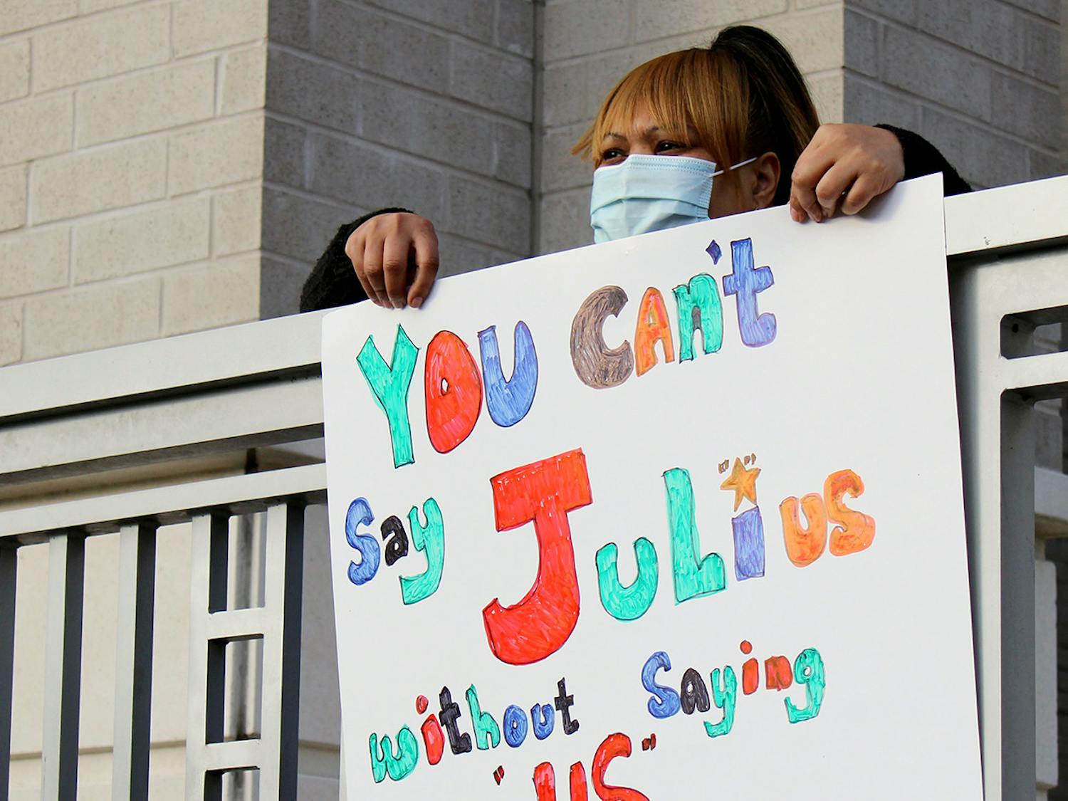 Tequila McKnight, 44, who is a friend and former neighbor of Julius Irving holds a sign in support of Irving at a rally outside of the Alachua County Criminal Justice Center on Monday, Feb. 8, 2021.