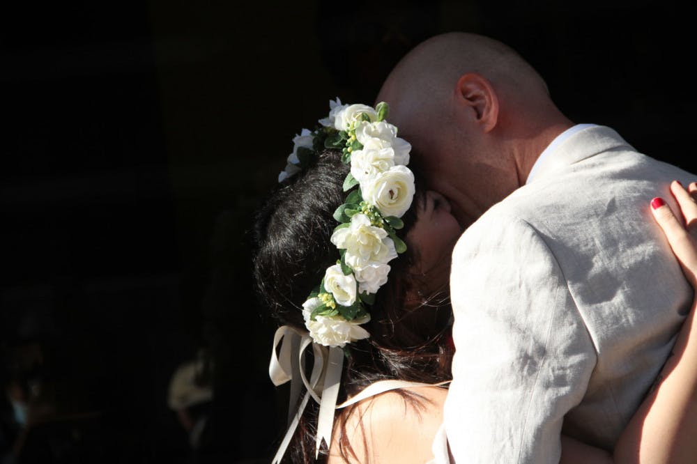 Dina Benbrahim and Kari Thorleifsson seal their marriage with a kiss at the Clerk of Court’s office Wednesday evening.
&nbsp;