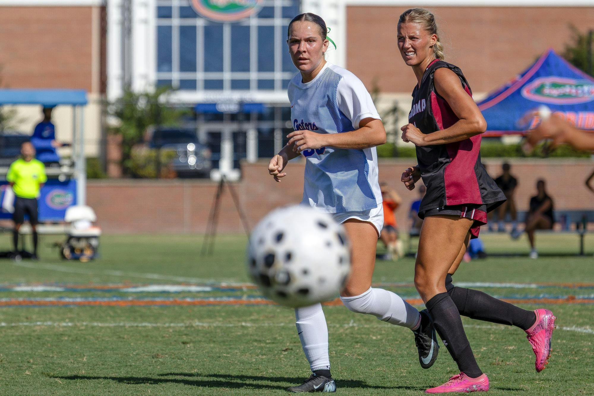 Player for Florida and Carolina anticipate where to intercept the ball after a goalie kick.