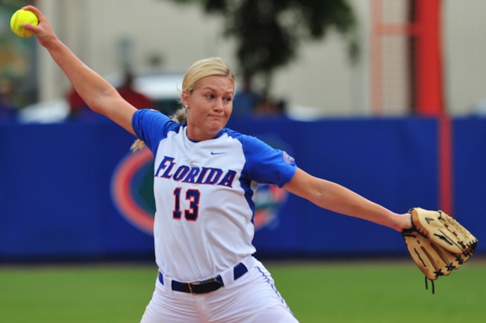 <p>Sophomore Hannah Rogers throws during a 4-1 victory&nbsp;against Auburn last season. Rogers is working on lowering her ERA early in 2013.</p>