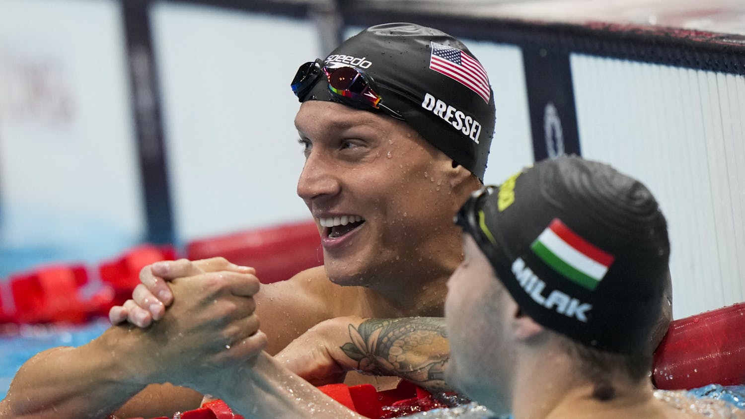 Caeleb Dressel, of United States, celebrates after wining the gold medal in the men&#x27;s 100-meter butterfly final at the 2020 Summer Olympics, Saturday, July 31, 2021, in Tokyo, Japan. (AP Photo/David Goldman)