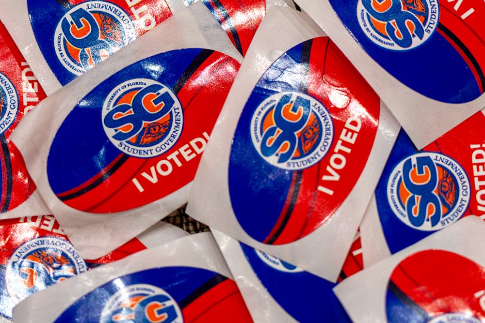 <p>Participants voting in the University of Florida Student Government elections receive stickers upon returning their voting card. Photo Illustration captured Tuesday, Sept. 30, 2025.</p>