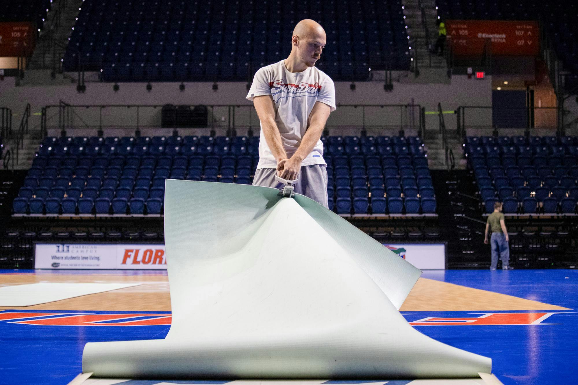 A student employee pulls up the volleyball court at the Stephen C. O'Connell Center, Sunday, Oct. 25, 2026, in Gainesville, Fla.