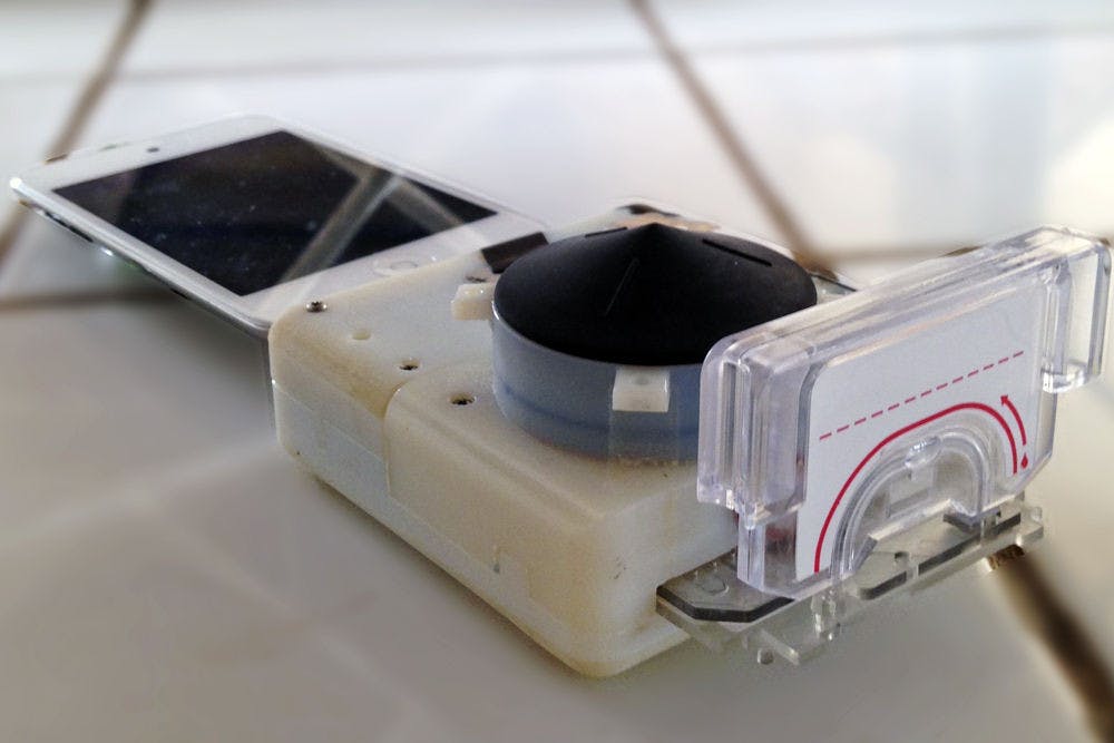 Pictured is one of the smartphone dongles that can test for HIV and syphilis. Funded by the Saving Lives at Birth program through the U.S. Agency for International Development, the device costs $34 to make, plus $2 for each test cassette.