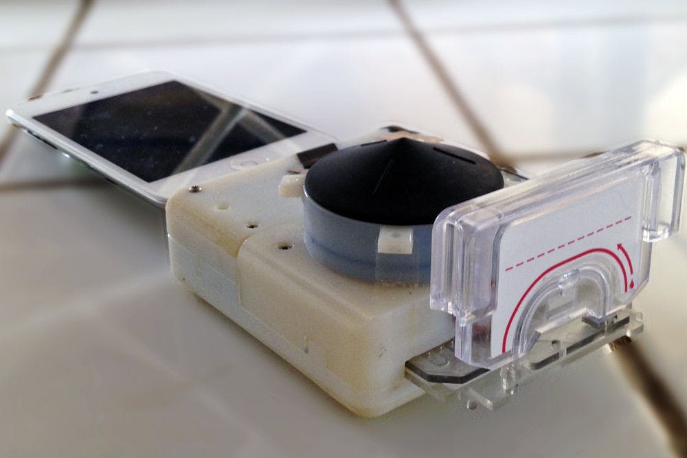 <p>Pictured is one of the smartphone dongles that can test for HIV and syphilis. Funded by the Saving Lives at Birth program through the U.S. Agency for International Development, the device costs $34 to make, plus $2 for each test cassette.</p>