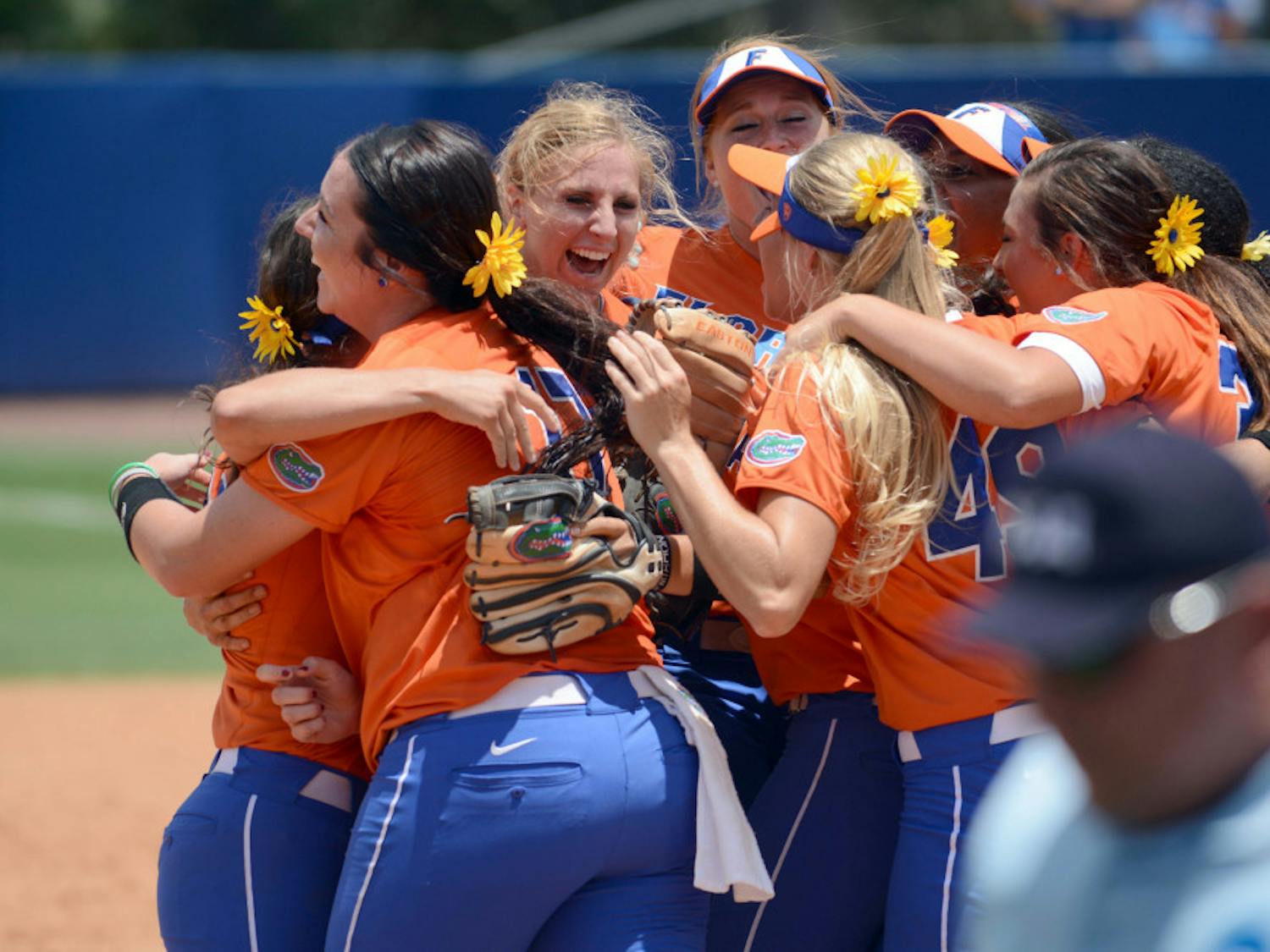 Florida softball players celebrate on the field of Katie Seashole Pressly Stadium following their 1-0 win over Kentucky on Sunday to advance to their seventh Women’s College World Series in eight years.