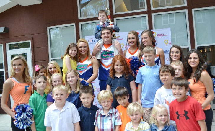 Nathan Ferrell sits on 18-year-old UF telecommunication freshman Tyler Jump’s shoulders Wednesday at Residence Inn Gainesville. Nathan is this year’s Children’s Miracle Network Hospitals Florida Champion.