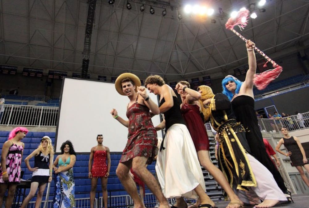 <p>Participants of the Mr. Relay Pageant dance on stage in the Stephen C. O'Connell Center while waiting for the results of the fundraising contest. The men dressed in drag raised over $800 for Relay for Life.</p>