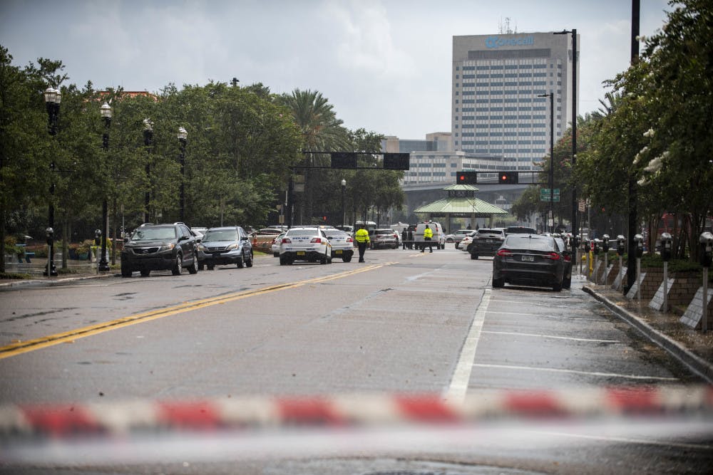 <p>Police barricade a street near the Jacksonville Landing in Jacksonville, Fla., Sunday, Aug. 26, 2018. Florida authorities are reporting multiple fatalities after a mass shooting at the riverfront mall in Jacksonville that was hosting a video game tournament. (AP Photo/Laura Heald)</p>