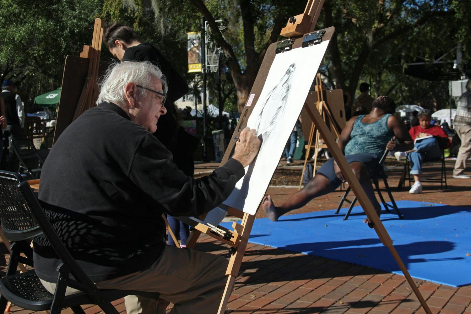 The 40th Downtown Festival &amp; Art Show was shortened to one day due to rainy weather. Various artists showcased their work in downtown Gainesville this weekend, from paintings, sculptures and jewelry to dance, and more. There was also a children's activities area that allowed little artists to create their own masterpieces.&nbsp;