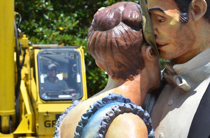 Dowd Studio &amp; Artworks employees remove the top part of the “Whispering Close” sculpture on the Plaza of the Americas on Monday.&nbsp;
&nbsp;