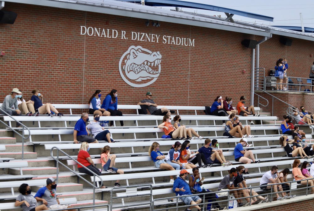 Groups of fans social distance and wear masks at Florida's first home game of the season. Friday is their final game in Donald R. Dizney Stadium this season, and the Gators look to recover their conference record with a win over the Volunteers.