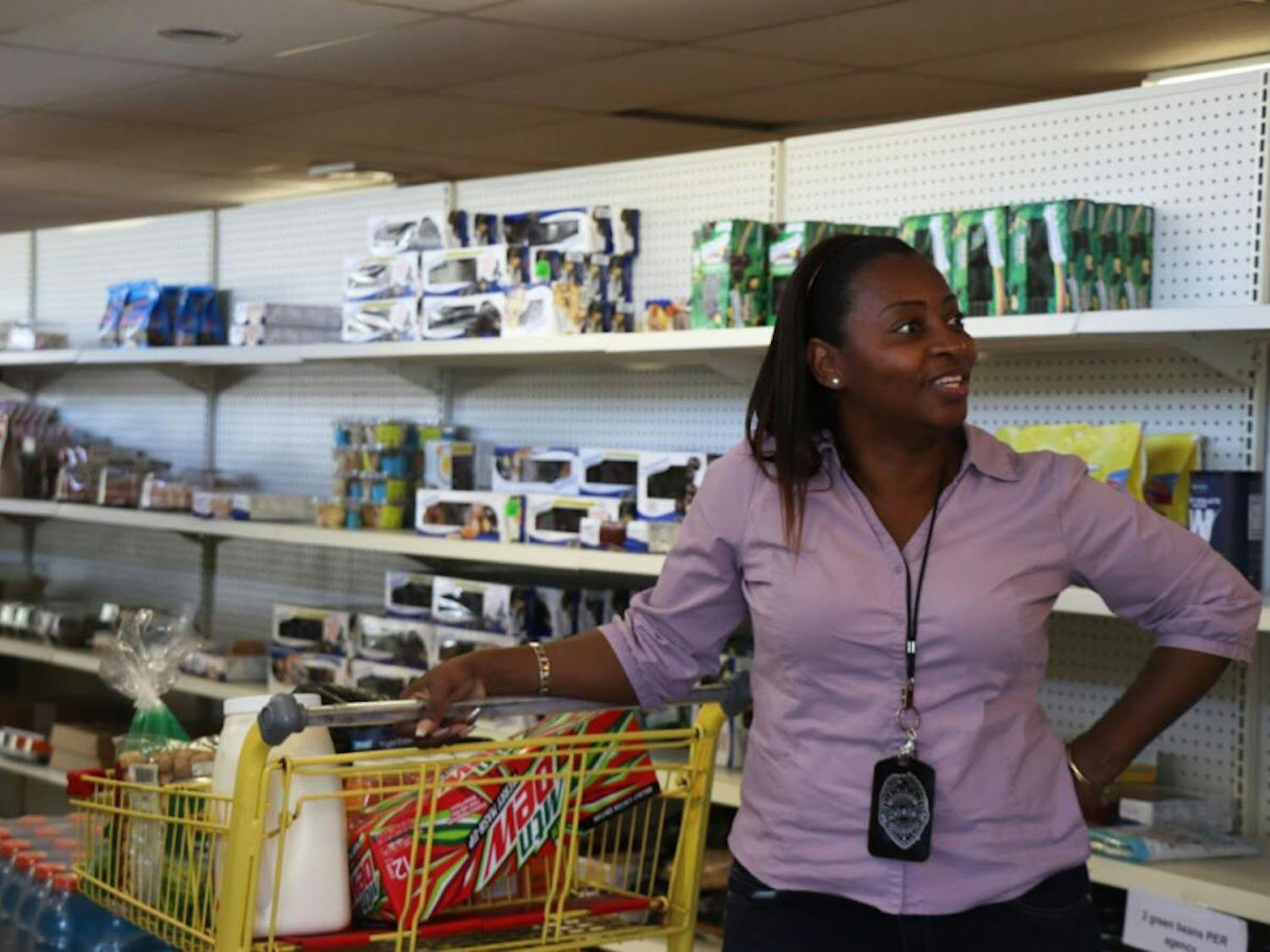 Pastor Crystal Griffin stops to talk to a friend while shopping for her ministry on Friday afternoon at the Bread of the Mighty Food Bank. The food bank distributes to five surrounding counties, including Alachua.