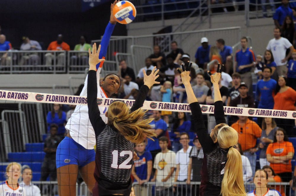 UF middle blocker Rhamat Alhassan swings for a kill during Florida's 3-0 win against Texas A&amp;M on Oct. 9, 2015, in the O'Connell Center.