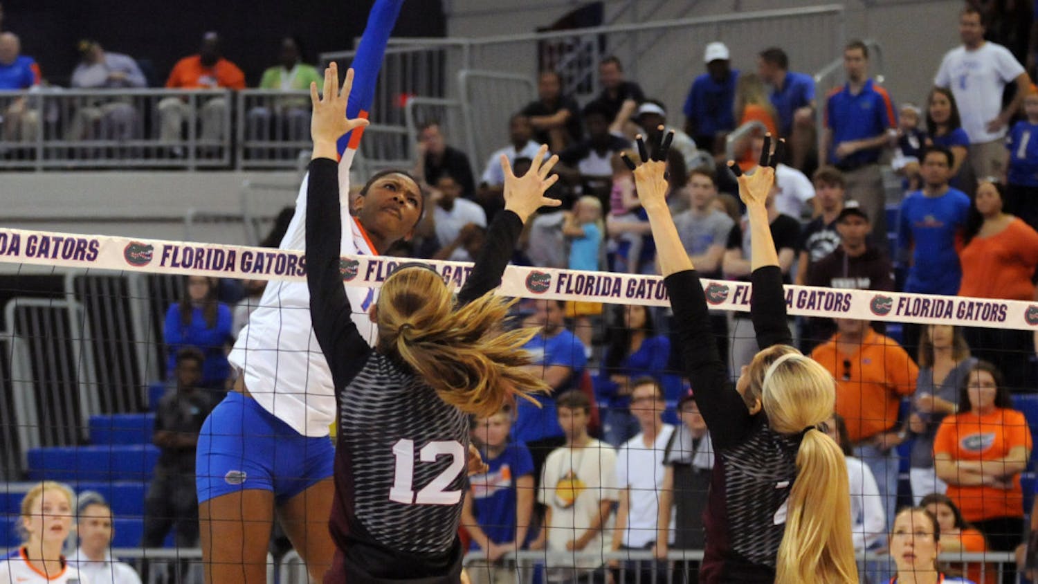 UF middle blocker Rhamat Alhassan swings for a kill during Florida's 3-0 win against Texas A&amp;M on Oct. 9, 2015, in the O'Connell Center.