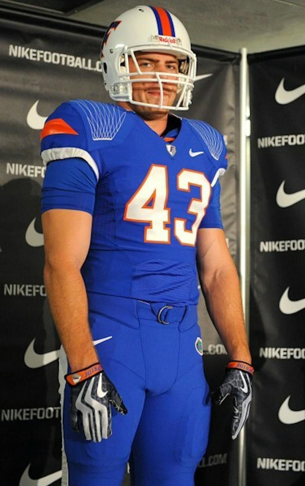 <p>Former Gator James Smith models the new Nike Pro Combat uniform at a news conference in the O’Connell Center, the Gators wore the uniforms in a 2009 game against Florida State.</p>