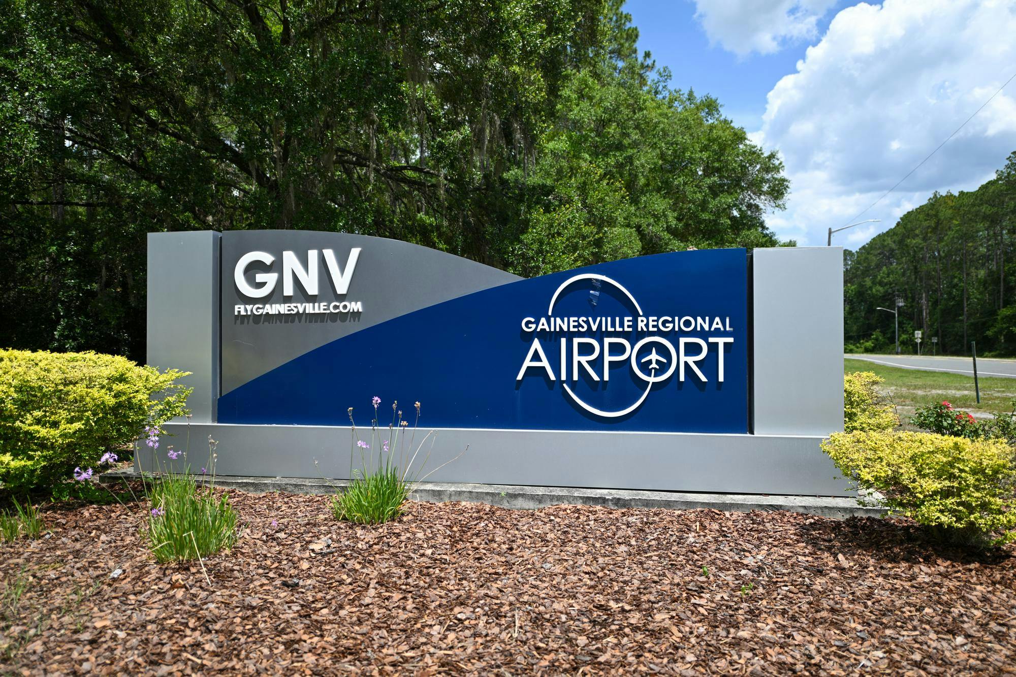A sign for Gainesville Regional Airport stands along NE 39th Avenue.