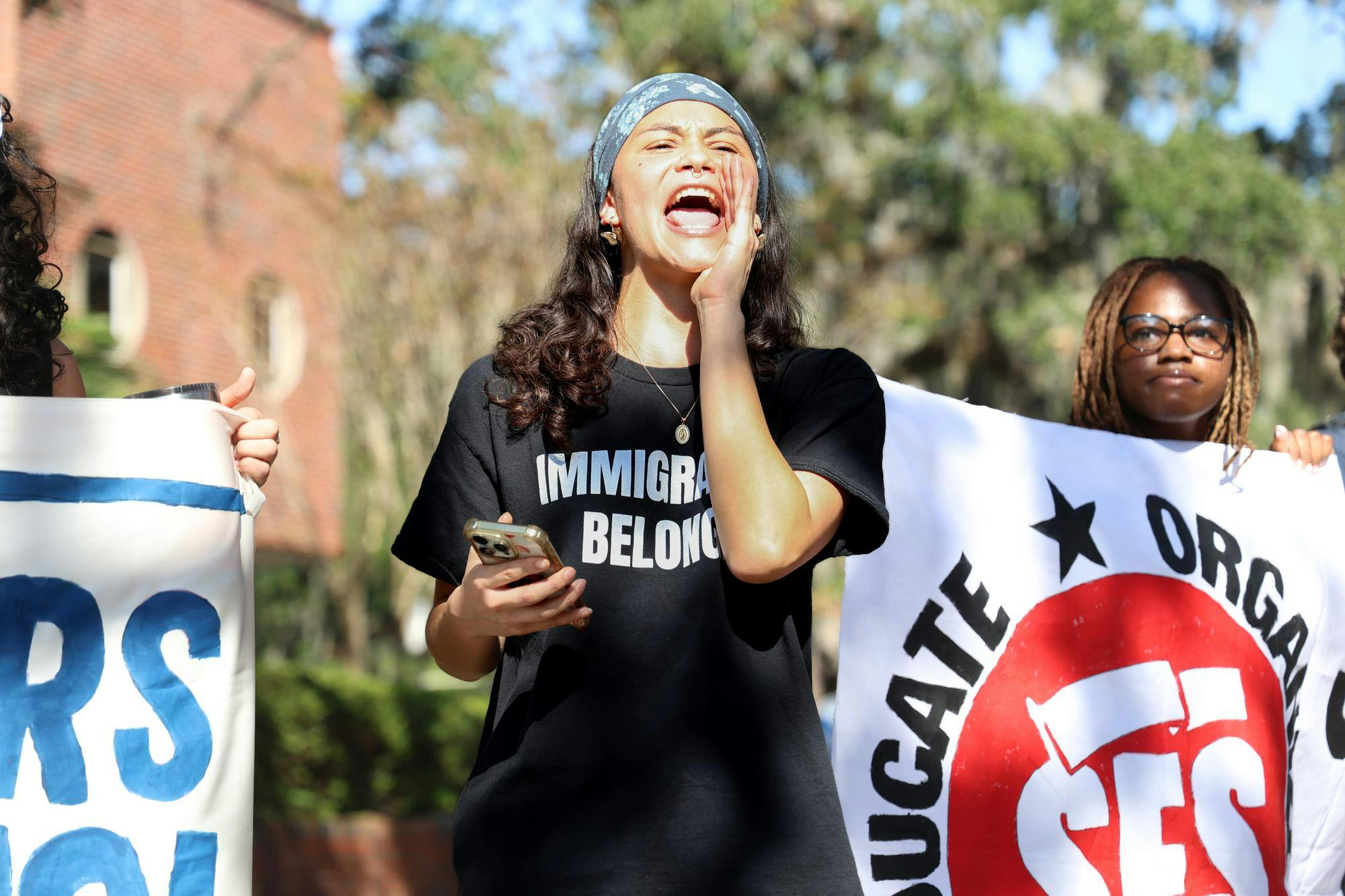 Dani Gonzalez leads chants at a Students for Socialism at the Unviersity of Floirda walkout to demand UFPD end its 287(g) agreement with ICE at Turlingotn Plaza, Thursday, Nov. 20, 2025.